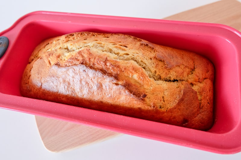 banana bread in red silicone baking pan